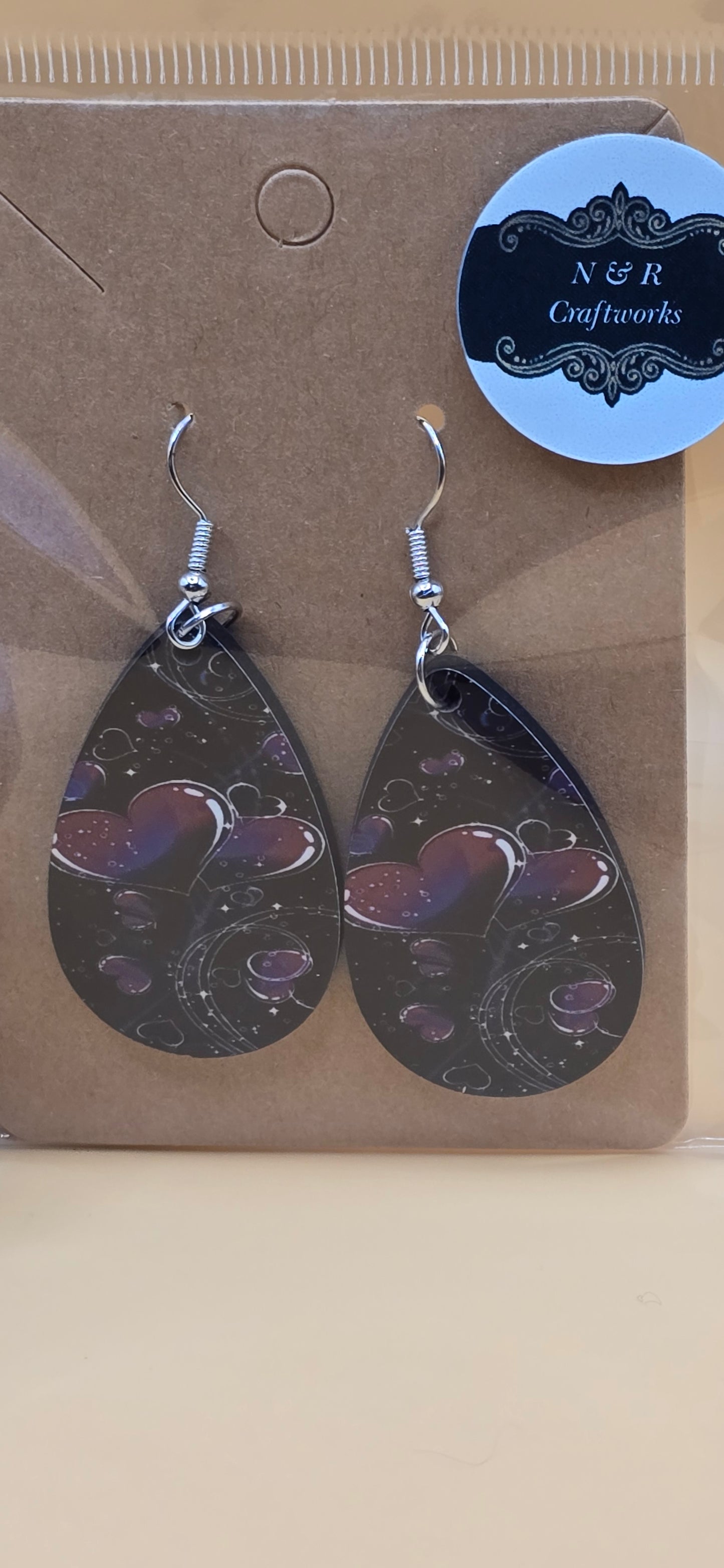 Beautiful Hearts on black background earrings