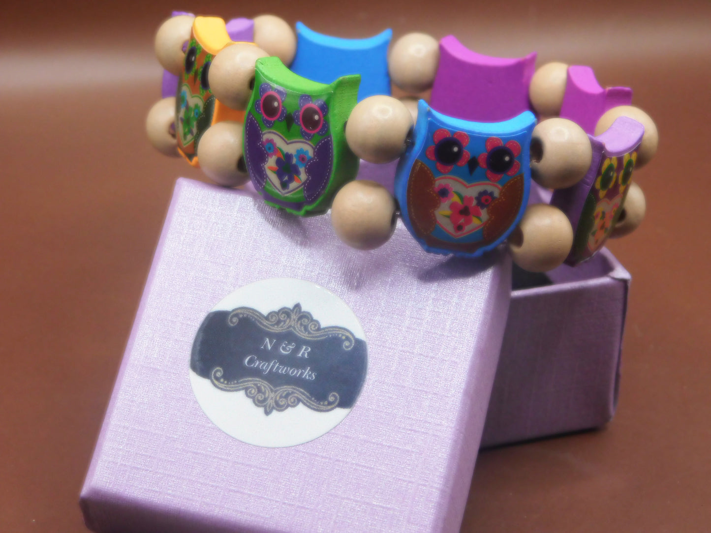 Multicolored wood beads owl inspired braclet
