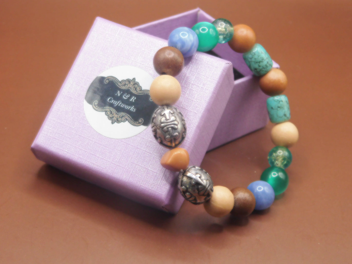 Elegance meets classy with this stunning wood and acrylic beaded braclet