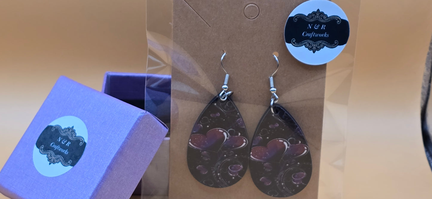Beautiful Hearts on black background earrings