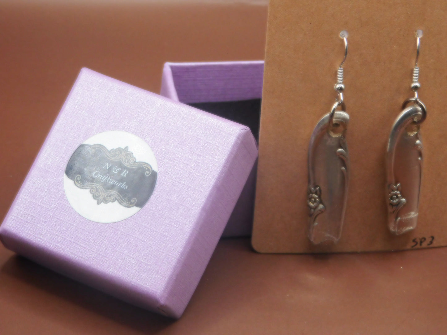 Add elegance and charm with these repurposed, vintage silver-plated spoon handle earrings