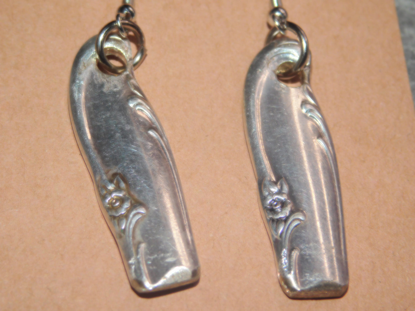 Add elegance and charm with these repurposed, vintage silver-plated spoon handle earrings